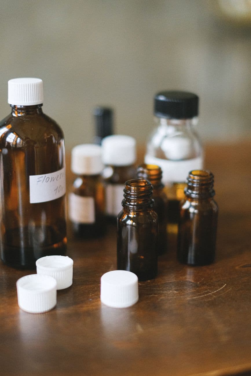Brown glass remedy bottles on a wooden table